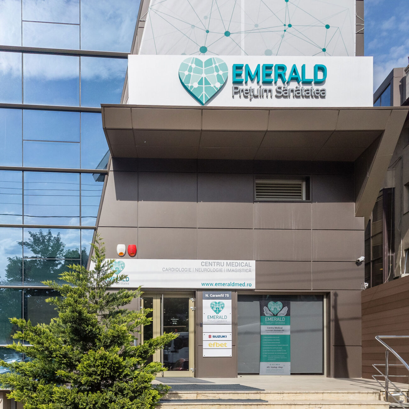 Emerald Medical Center health and fitness project by STIRIXIS Group showing exterior building facade with Emerald Premium Services branded signage