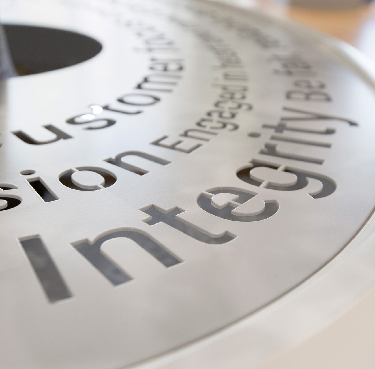 Elpedison retail project by STIRIXIS Group showing close-up of brand values typography with integrity and customer engagement messaging