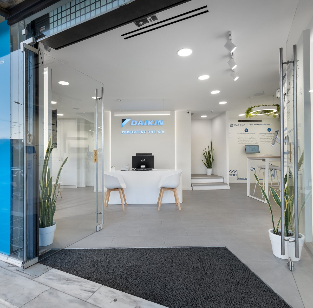 Daikin retail project by STIRIXIS Group showing Chalandri showroom entrance with blue brand accents and glazed facade