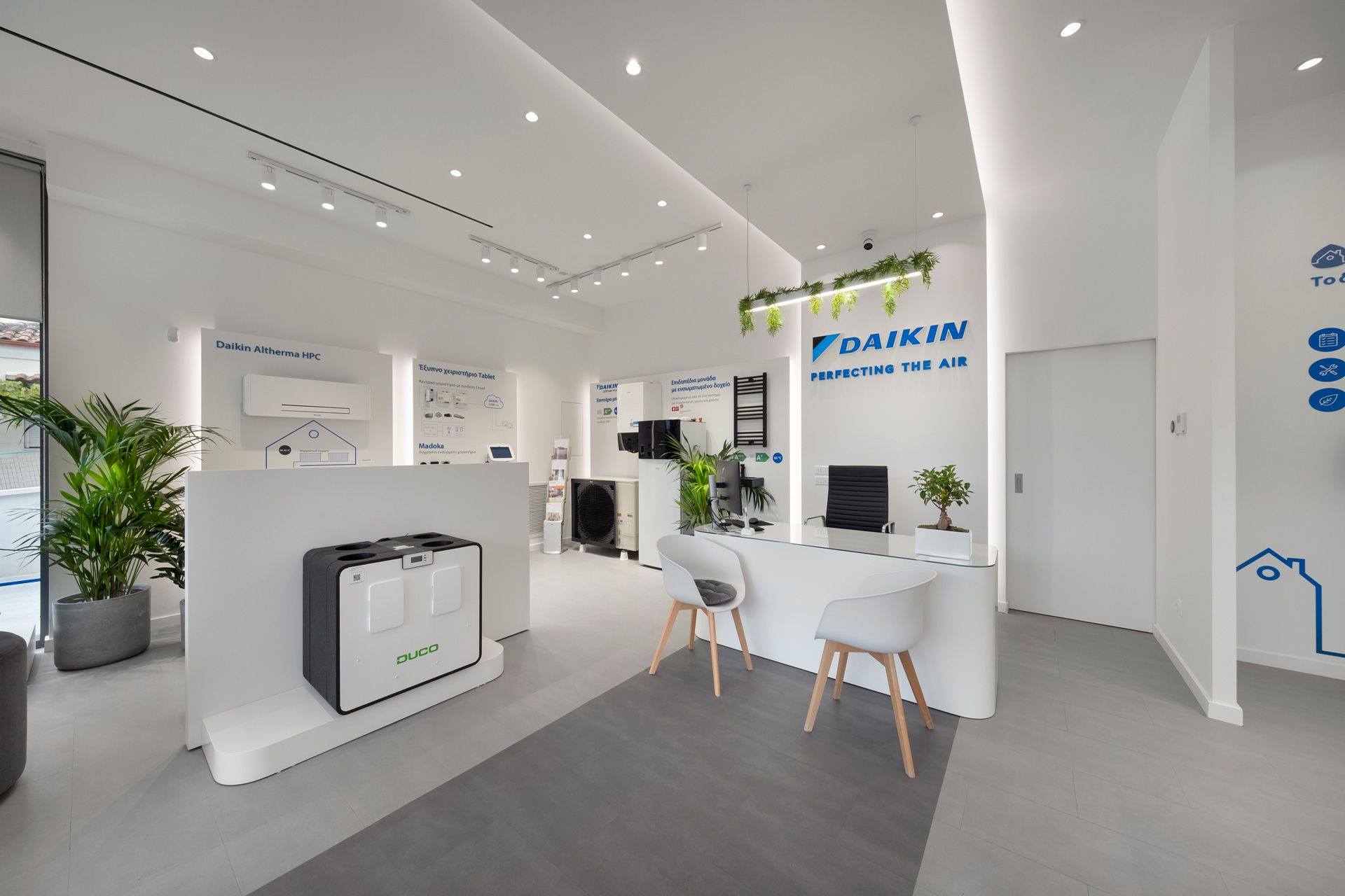 Daikin retail project by STIRIXIS Group showing Lamia showroom interior with product display units and clean white retail environment