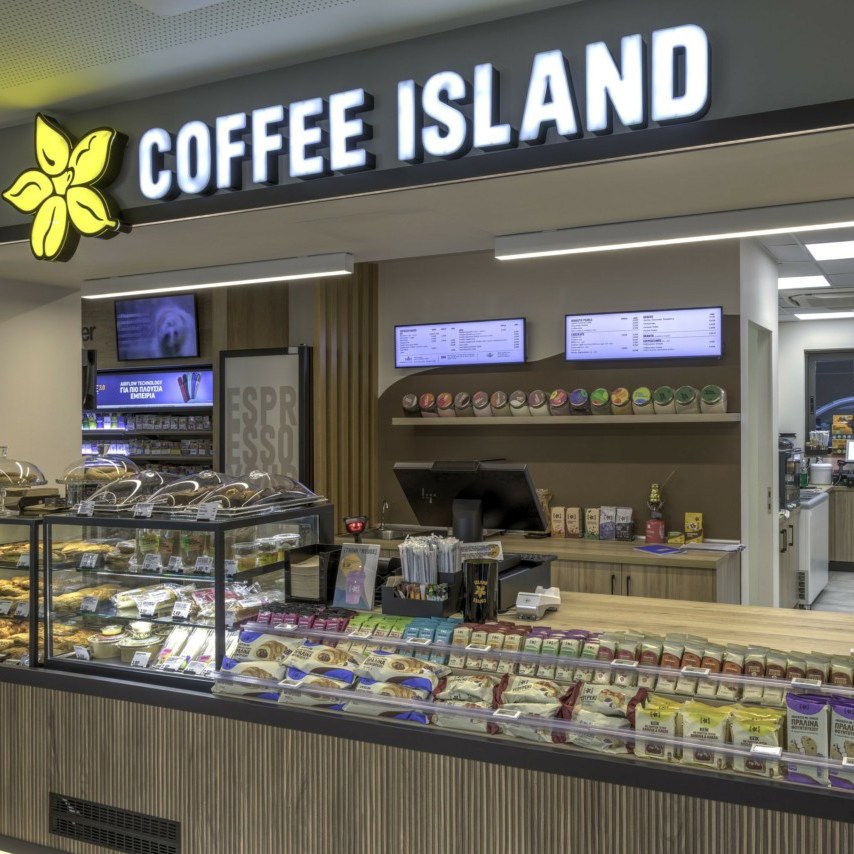 Coffee Island counter inside the EKO Flagship Station in Kifisia, with fresh pastries, snacks and drive-through pick-up service.