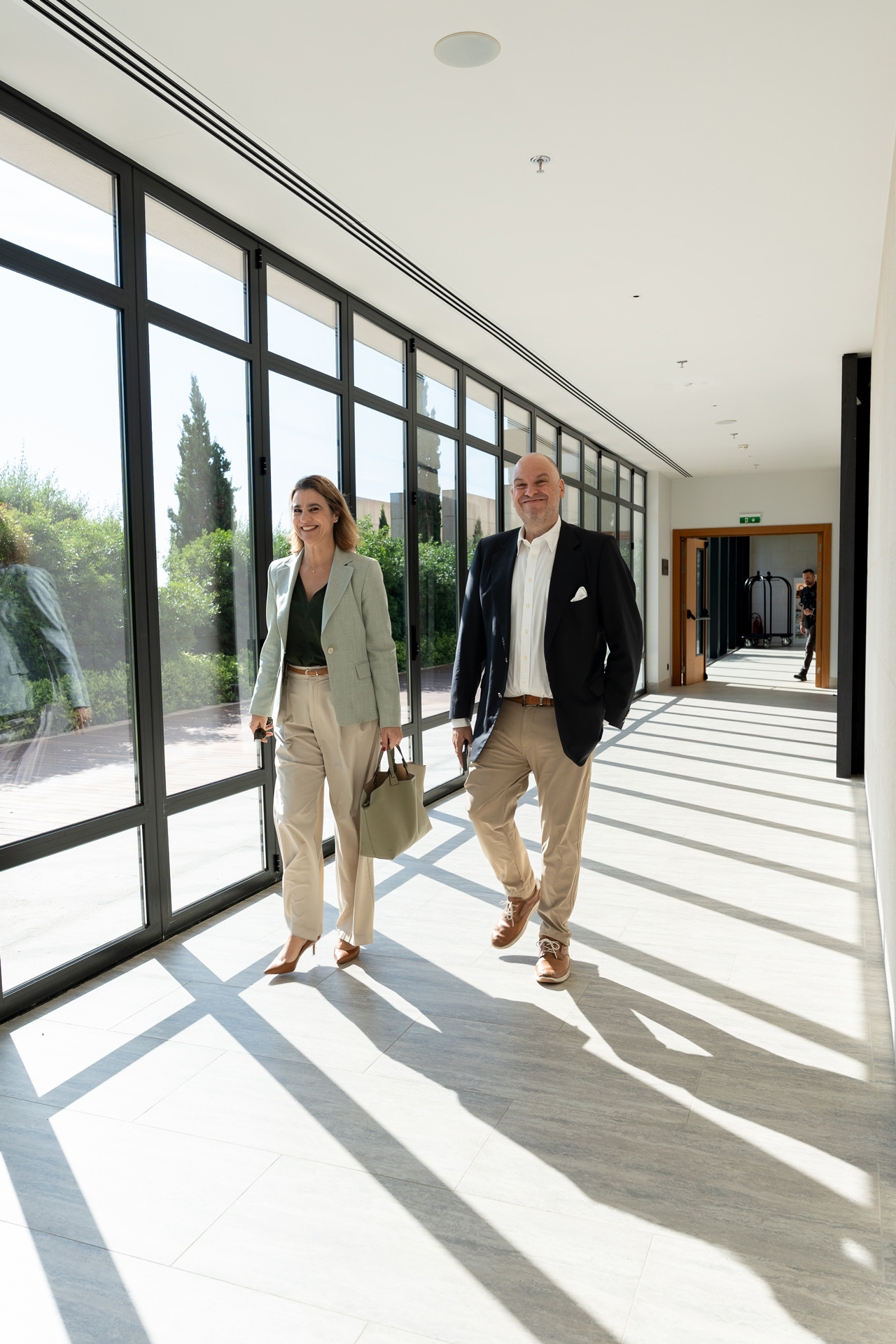 Alex Athanassoulas and Elena Athanassoula walking through the Angsana Corfu Resort & Spa venue during the Forbes Global Properties Annual Global Conference 2026, Corfu, Greece.