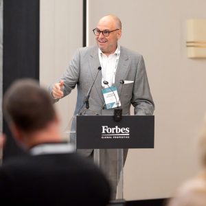 Alex Athanassoulas speaking at the Forbes Global Properties podium during the Annual Global Conference 2026 in Corfu, Greece.Alex Athanassoulas speaking at the Forbes Global Properties podium during the Annual Global Conference 2026 in Corfu, Greece.