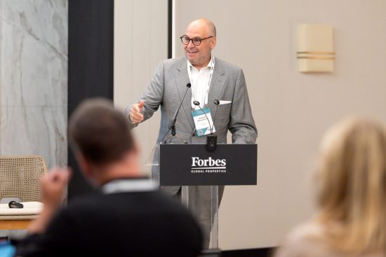 Alex Athanassoulas speaking at the Forbes Global Properties podium during the Annual Global Conference 2026 in Corfu, Greece.Alex Athanassoulas speaking at the Forbes Global Properties podium during the Annual Global Conference 2026 in Corfu, Greece.
