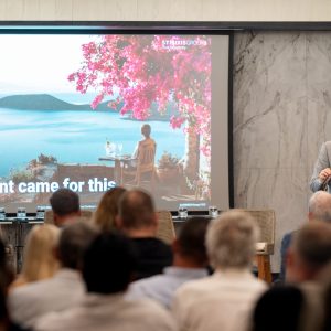 Alex Athanassoulas presenting the STIRIXIS Group keynote to a full audience at the Forbes Global Properties Annual Global Conference 2026 in Corfu, Greece.