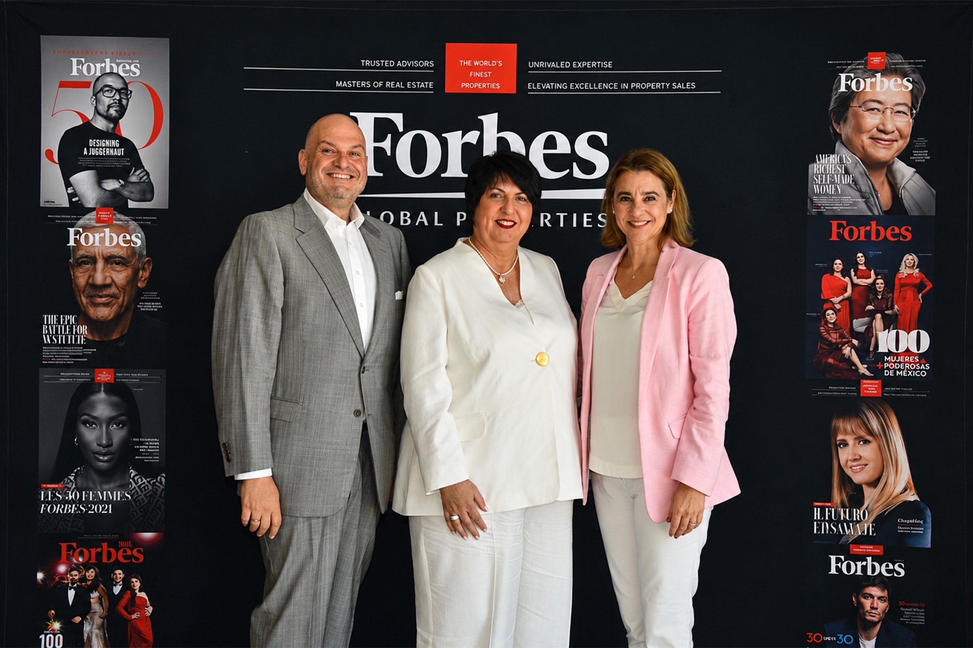 Alex Athanassoulas, Roula Rouva and Elena Athanassoula at the Forbes Global Properties backdrop, Corfu 2026.