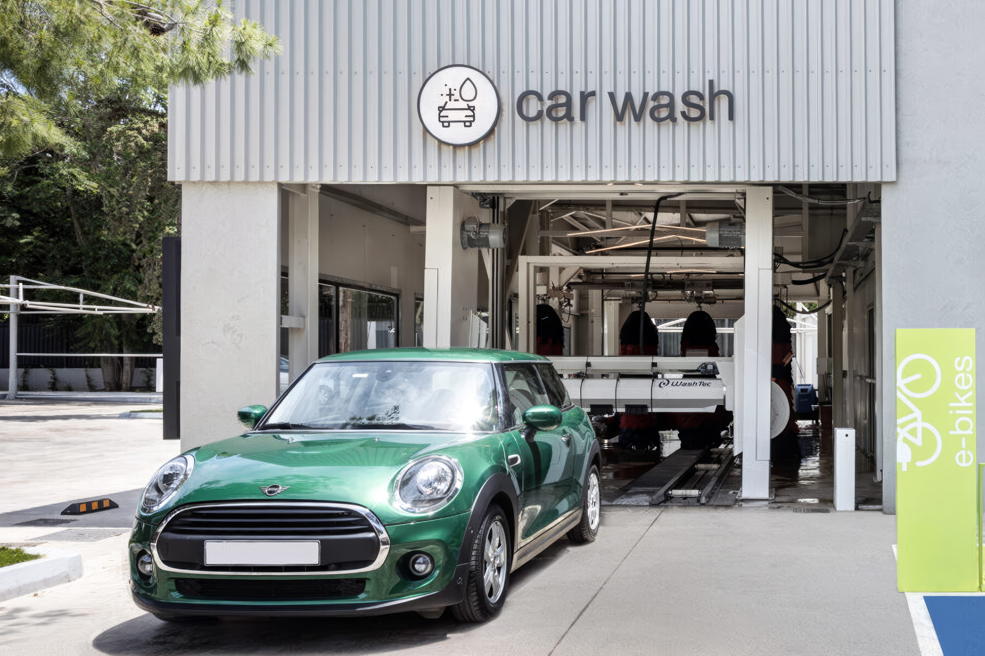 EKO Flagship Station in Kifisia showing the car wash entrance with branded signage and a vehicle entering the wash area.