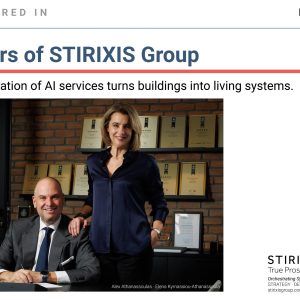 Editorial card marking STIRIXIS Group's feature in Newmoney on 14 July 2026, showing co-founders Alexandros Athanassoulas and Elena Kyrnassiou-Athanassoula at the company's Athens offices, alongside the announcement of 30 years since founding and a new generation of AI services turning buildings into living systems