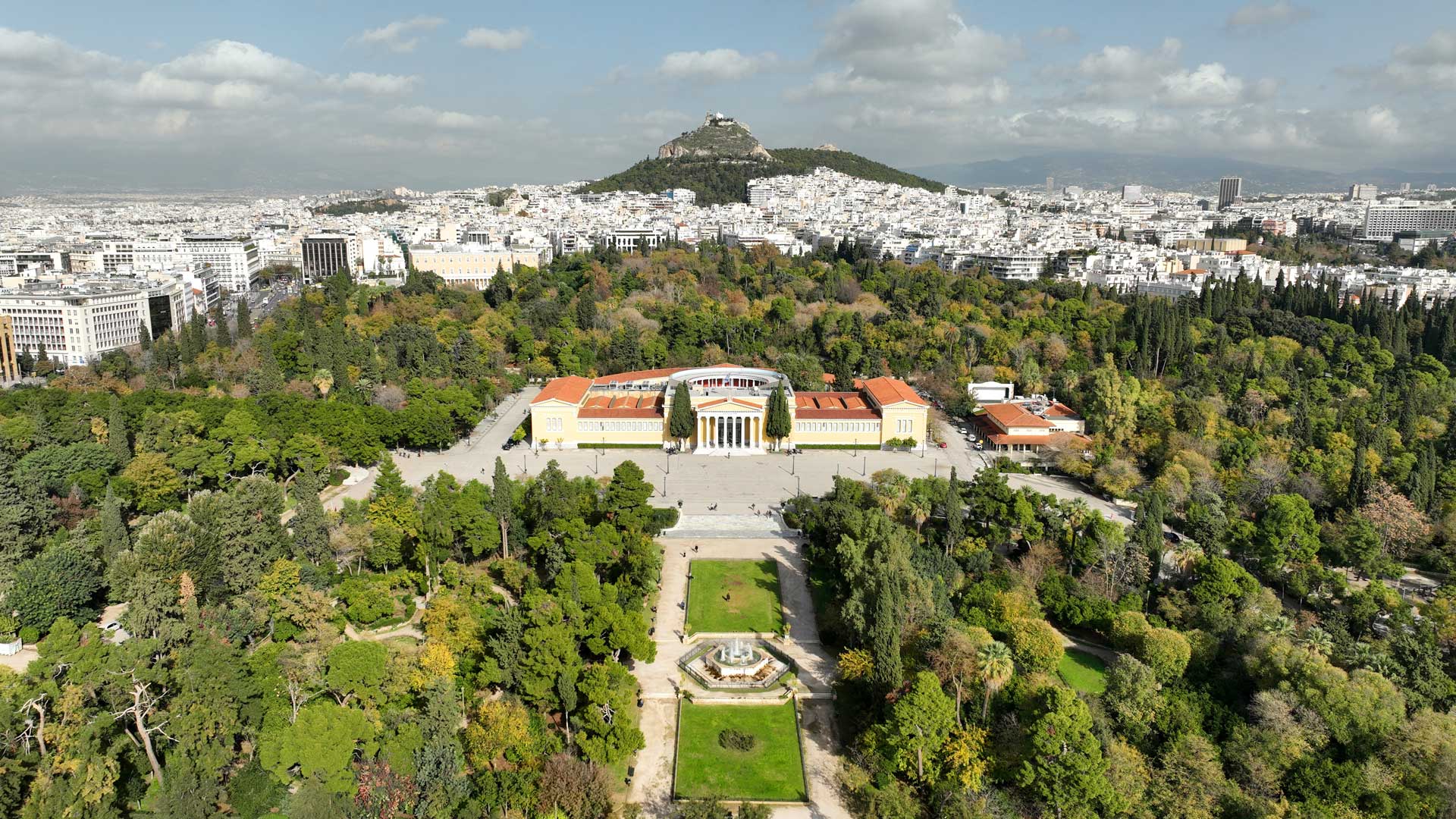 Aerial view of Zappeion and the National Garden in Athens, showing civic architecture, greenery and public space within the urban landscape.