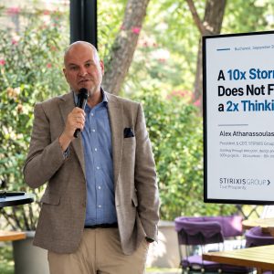 Alex Athanassoulas, President & CEO of STIRIXIS Group, speaking beside his keynote presentation at CEO Clubs Romania Executive Club in Bucharest, September 2026.